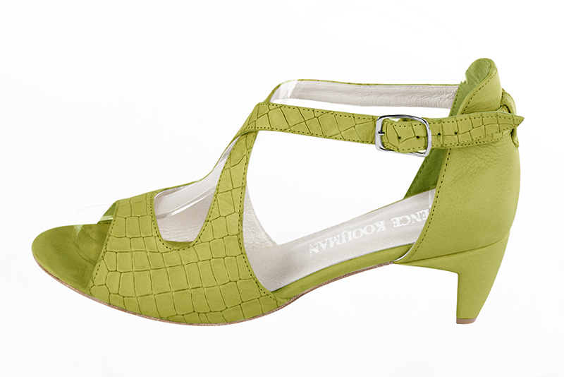 Pistachio green women's closed back sandals, with crossed straps. Round toe. Low comma heels. Profile view - Florence KOOIJMAN